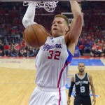 
              Los Angeles Clippers forward Blake Griffin (32) dunks as San Antonio Spurs guard Patty Mills, of Australia, watches during the first half of Game 7 in a first-round NBA basketball playoff series, Saturday, May 2, 2015, in Los Angeles. (AP Photo/Mark J. Terrill)
            