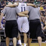 
              Utah Jazz's Dante Exum (11) is helped off the court after being injured during the second half of an NBA summer league basketball game against the Boston Celtics Monday, July 6, 2015, in Salt Lake City. The Jazz won 100-82. (AP Photo/Rick Bowmer)
            