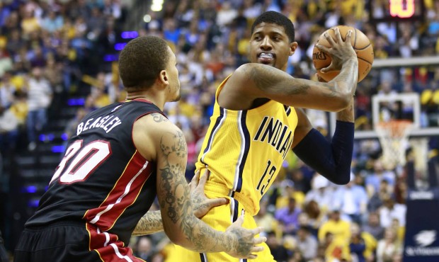 FILE – In this April 5, 2015 file photo, Indiana Pacers forward Paul George, right, controls ...