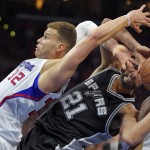 
              Los Angeles Clippers forward Blake Griffin, left, and San Antonio Spurs forward Tim Duncan battle for a rebound during the second half of Game 7 in a first-round NBA basketball playoff series, Saturday, May 2, 2015, in Los Angeles. The Clippers won 111-109. (AP Photo/Mark J. Terrill)
            