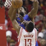 
              Houston Rockets' James Harden (13) is blocked by Los Angeles Clippers' DeAndre Jordan (6) during the first half in Game 5 of the NBA basketball Western Conference semifinals Tuesday, May 12, 2015, in Houston. (AP Photo/David J. Phillip)
            