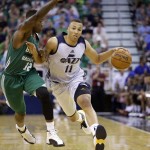 
              Boston Celtics' Terry Rozier (12) defends against Utah Jazz's Dante Exum (11) during the first half of an NBA summer league basketball game Monday, July 6, 2015, in Salt Lake City. (AP Photo/Rick Bowmer)
            