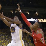 
              Golden State Warriors forward Harrison Barnes (40) shoots against Houston Rockets center Dwight Howard (12) during the second half of Game 5 of the NBA basketball Western Conference finals in Oakland, Calif., Wednesday, May 27, 2015. (AP Photo/Ben Margot)
            