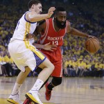 
              Houston Rockets' James Harden, right, drives the ball against Golden State Warriors' Klay Thompson during the first quarter of Game 1 of the NBA basketball Western Conference finals Tuesday, May 19, 2015, in Oakland, Calif. (AP Photo/Ben Margot)
            