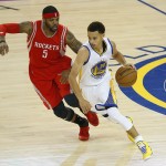 
              Golden State Warriors guard Stephen Curry (30) dribbles against Houston Rockets forward Josh Smith (5) during the first half of Game 1 of the NBA basketball Western Conference finals in Oakland, Calif., Tuesday, May 19, 2015. (AP Photo/Tony Avelar)
            