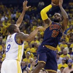 
              Cleveland Cavaliers forward LeBron James (23) shoots against Golden State Warriors forward Andre Iguodala (9) during the first half of Game 1 of basketball's NBA Finals in Oakland, Calif., Thursday, June 4, 2015. (AP Photo/Ben Margot)
            