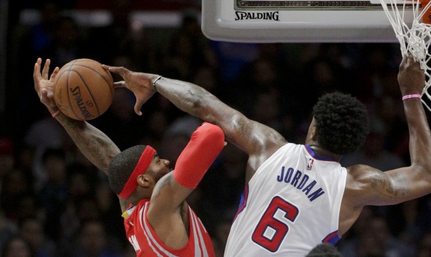 Los Angeles Clippers center DeAndre Jordan, right, fouls Houston Rockets forward Josh Smith during ...
