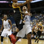 
              Tulsa Shock guard Riquna Williams, front left, pushes the ball up to the basket before being fouled by Minnesota Lynx forward Damiris Dantas (34) during the first half of a WNBA basketball game, Sunday, June 21, 2015, in Minneapolis. (AP Photo/Stacy Bengs)
            
