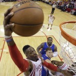 
              Houston Rockets' Dwight Howard (12) drives to the basket over Los Angeles Clippers' Blake Griffin, center bottom, and DeAndre Jordan, center top, during the first half in Game 5 of the NBA basketball Western Conference semifinals Tuesday, May 12, 2015, in Houston. (AP Photo/David J. Phillip)
            