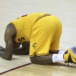 
              Cleveland Cavaliers' LeBron James, lies exhausted on the floor after the Cavaliers beat the Atlanta Hawks 114-111 in overtime in Game 3 of the Eastern Conference finals of the NBA basketball playoffs Sunday, May 24, 2015, in Cleveland. (AP Photo/Ron Schwane)
            