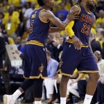 
              Cleveland Cavaliers guard J.R. Smith (5) and forward LeBron James (23) react during the second half of Game 2 of basketball's NBA Finals against the Golden State Warriors in Oakland, Calif., Sunday, June 7, 2015. (AP Photo/Ben Margot)
            