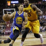 
              Golden State Warriors guard Stephen Curry (30) drives on Cleveland Cavaliers center Tristan Thompson (13) during the second half of Game 3 of basketball's NBA Finals in Cleveland, Tuesday, June 9, 2015. (AP Photo/Tony Dejak)
            