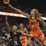               West’s Brittney Griner, right, of the Phoenix Mercury, blocks a shot attempt by East’s Alex Bentley, left, of the Connecticut Sun during the first half of the WNBA All-Star basketball game, Saturday, July 25, 2015, in Uncasville, Conn. (AP Photo/Jessica Hill)
            