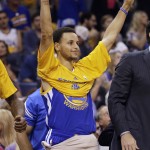 
              Golden State Warriors guard Stephen Curry gestures from the sidelines during the second half of Game 6 of a second-round NBA basketball Western Conference playoff series against the Memphis Grizzlies, Friday, May 15, 2015, in Memphis, Tenn. (AP Photo/Mark Humphrey)
            