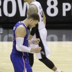 
              Los Angeles Clippers' Blake Griffin, foreground, clinches his fists as time expires during the second half of Game 6 in an NBA basketball first-round playoff series, Thursday, April 30, 2015, in San Antonio. Los Angeles won 102-96. (AP Photo/Eric Gay)
            