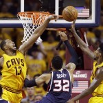 
              Cleveland Cavaliers' Tristan Thompson (13) and Iman Shumpert block a shot by Atlanta Hawks' Mike Scott (32) during the second half in Game 3 of the Eastern Conference finals of the NBA basketball playoffs Sunday, May 24, 2015, in Cleveland. (AP Photo/Tony Dejak)
            