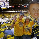 
              In this photo taken on Sunday, June 7, 2015, Jan and Mark Wilson prepare for Game 2 of basketball's NBA Finals in Oakland, Calif. It has been 40 years since Golden State's loud and loyal fans could experience the NBA Finals. After decades of bad drafts, terrible trades and lots of losses, the most hardened Warriors’ supporters are soaking in every second of this run.  After all, many have waited their entire lives to experience this moment. (AP Photo/Ben Margot)
            