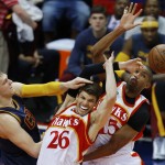 
              Cleveland Cavaliers center Timofey Mozgov (20) Atlanta Hawks' Kyle Korver (26) and Al Horford (15) vie for a rebound during the first half in Game 2 of the Eastern Conference finals of the NBA basketball playoffs, Friday, May 22, 2015, in Atlanta. (AP Photo/Todd Kirkland)
            
