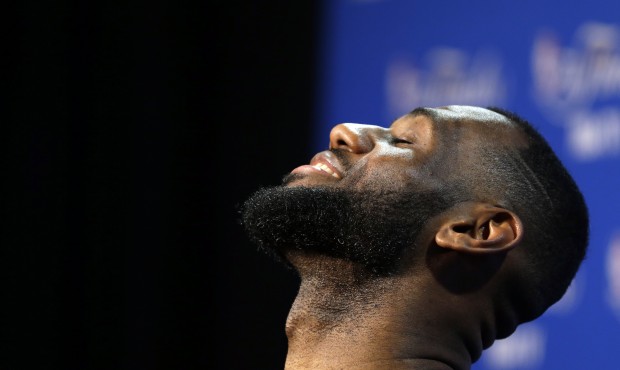 Cleveland Cavaliers forward LeBron James answers a question during a press conference for basketbal...
