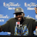               Golden State Warriors forward Draymond Green (23) reacts during a news conference following Game 6 of basketball's NBA Finals against the Cleveland Cavaliers, in Cleveland, Wednesday, June 17, 2015. The Warriors defeated the Cavaliers 105-97 to win the best-of-seven game series 4-2. (AP Photo/Paul Sancya)
            