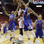 
              Los Angeles Clippers guard Dahntay Jones (31), Houston Rockets guard Corey Brewer (33) and forward Blake Griffin (32) go after the ball during the second half in Game 7 of the NBA basketball Western Conference semifinals Sunday, May 17, 2015, in Houston. (AP Photo/David J. Phillip)
            