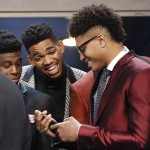 
              From left, NBA draft prospects Emmanuel Mudiay, Karl-Anthony Towns and Kelly Oubre Jr. talk during a photo op before the NBA basketball draft, Thursday, June 25, 2015, in New York. (AP Photo/Kathy Willens)
            