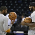 
              Cleveland Cavaliers' Kyrie Irving, left, and LeBron James talk during NBA basketball practice, Wednesday, June 3, 2015, in Oakland, Calif. The Golden State Warriors host the Cavaliers in Game 1 of the NBA Finals on Thursday. (AP Photo/Ben Margot)
            
