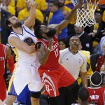 
              Houston Rockets guard James Harden (13) dunks in front of Golden State Warriors center Andrew Bogut during the first half of Game 5 of the NBA basketball Western Conference finals in Oakland, Calif., Wednesday, May 27, 2015. (AP Photo/Tony Avelar)
            