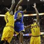 
              Golden State Warriors guard Leandro Barbosa (19) attempts a shoot between Cleveland Cavaliers forward James Jones (1) and guard J.R. Smith (5) during the second half of Game 3 of basketball's NBA Finals in Cleveland, Tuesday, June 9, 2015. (AP Photo/Tony Dejak)
            
