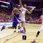 
              Los Angeles Clippers' Chris Paul (3) drives around Houston Rockets' Trevor Ariza (1) and Dwight Howard (12) during the second half in Game 5 of the NBA basketball Western Conference semifinals Tuesday, May 12, 2015, in Houston. (AP Photo/David J. Phillip)
            