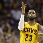 
              Cleveland Cavaliers forward LeBron James (23) celebrates a play against the Golden State Warriors during the second half of Game 3 of basketball's NBA Finals in Cleveland, Tuesday, June 9, 2015. (AP Photo/Tony Dejak)
            