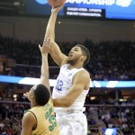 
              FILE - In this March 28, 2015, file photo, Kentucky's Karl-Anthony Towns (12) shoots over Notre Dame's Bonzie Colson (35) in the first half of a college basketball game in the NCAA men's tournament regional finals in Cleveland. Towns seems the likely pick by the Minnesota Timberwolves at No. 1 in the NBA draft on Thursday, June 25, 2015. (AP Photo/David Richard. File)
            