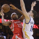 
              Houston Rockets guard Corey Brewer (33) tries to shoot against Golden State Warriors guard Klay Thompson during the first half of Game 5 of the NBA basketball Western Conference finals in Oakland, Calif., Wednesday, May 27, 2015. (AP Photo/Ben Margot)
            