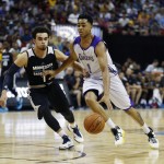 
              Los Angeles Lakers’ D'Angelo Russell drives by Minnesota Timberwolves’ Tyus Jones during the first half of their NBA summer league basketball game Friday, July 10, 2015, in Las Vegas. (AP Photo/John Locher)
            