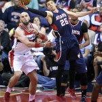 
              Atlanta Hawks guard Kyle Korver (26) grabs a rebound in front of Washington Wizards center Marcin Gortat, left, of Poland, in the first half of Game 6 of the second round of the NBA basketball playoffs, Friday, May 15, 2015, in Washington. (AP Photo/Nick Wass)
            