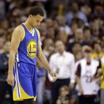 
              Golden State Warriors guard Stephen Curry (30) walks down the court with his head down in the closing seconds of Game 3 of basketball's NBA Finals against the Cleveland Cavaliers in Cleveland, Tuesday, June 9, 2015. The Cavaliers defeated the Warriors 96-91. AP Photo/Tony Dejak)
            