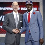 
              Jerian Grant, right poses for photos with NBA Commissioner Adam Silver after being selected 19th overall by the Washington Wizards during the NBA basketball draft, Thursday, June 25, 2015, in New York. (AP Photo/Kathy Willens)
            