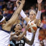               FILE - In this May 16, 2014, file photo, New York Liberty's Cappie Pondexter, center, drives past Connecticut Sun's Kelsey Bone, left and Katie Douglas, right,  during the first half of an WNBA basketball game in Uncasville, Conn. The Chicago Sky didn't stand pat in the offseason, acquiring Chicago native Cappie Pondexter from the Liberty for Epiphanny Prince. Pondexter won two titles with Phoenix and was the MVP of the finals in 2009. (AP Photo/Fred Beckham, File)
            