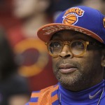 
              FILE - In this Feb. 27, 2011, file photo, film director Spike Lee watches practice before an NBA basketball game between the New York Knicks and Miami Heat in Miami. "NBA 2K16" will be a Spike Lee joint. 2K Games announced Thursday, June 4, 2015, that it recruited the die-hard NBA fan and acclaimed filmmaker to write, direct and produce the single-player campaign for the next edition of the interactive basketball series. (AP Photo/Alan Diaz, File)
            