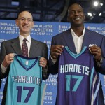               NBA Commissioner Adam Silver, left, and Charlotte Hornets owner Michael Jordan, right, pose for a photo during a news conference, Tuesday, June 23, 2015, to announce Charlotte, N.C., as the site of the 2017 NBA All-Star basketball game. (AP Photo/Chuck Burton)
            