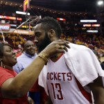 
              Houston Rockets' James Harden (13) hugs his mother, Monja Willis,  following Game 5 in the first round of the NBA basketball playoffs against the Dallas Mavericks, Tuesday, April 28, 2015, in Houston. Houston won the game 103-94 and the series 4-1. (AP Photo/David J. Phillip)
            