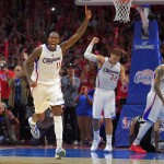              Los Angeles Clippers guard Jamal Crawford, front left, celebrates along with forward Blake Griffin, center, and forward Matt Barnes after they defeated the San Antonio Spurs in Game 7 in a first-round NBA basketball playoff series, Saturday, May 2, 2015, in Los Angeles. The Clippers won 111-109. (AP Photo/Mark J. Terrill)
            