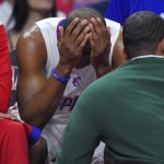
              Los Angeles Clippers guard Chris Paul sits on the bench after injuring his leg during the first half of Game 7 in a first-round NBA basketball playoff series against the San Antonio Spurs, Saturday, May 2, 2015, in Los Angeles. (AP Photo/Mark J. Terrill)
            
