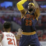 
              Cleveland Cavaliers forward LeBron James, right, shoots against Chicago Bulls guard Jimmy Butler during the first half of Game 3 in a second-round NBA basketball playoff series in Chicago on Friday, May 8, 2015. (AP Photo/Nam Y. Huh)
            