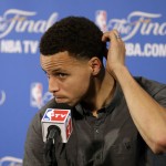 
              Golden State Warriors guard Stephen Curry takes questions during a news conference after Game 2 of basketball's NBA Finals Sunday, June 7, 2015, in Oakland, Calif. Cleveland won the game 95-93 in overtime. (AP Photo/Ben Margot)
            