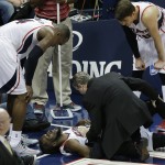 
              Atlanta Hawks forward DeMarre Carroll lies on the court and is attended to by medical staff after being injured against the Cleveland Cavaliers during the second half in Game 1 of the Eastern Conference finals of the NBA basketball playoffs, Wednesday, May 20, 2015, in Atlanta. (AP Photo/David Goldman)
            