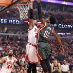 
              Milwaukee Bucks guard O.J. Mayo (00) shoots over Chicago Bulls forward Taj Gibson during the first half in Game 5 of the NBA basketball playoffs Monday, April 27, 2015, in Chicago. (AP Photo/Charles Rex Arbogast)
            