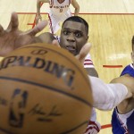 
              Houston Rockets' Terrence Jones, left, and Los Angeles Clippers' Blake Griffin reach for a rebound during the second half of Game 2 in a second-round NBA basketball playoff series, Wednesday, May 6, 2015, in Houston. (AP Photo/David J. Phillip)
            