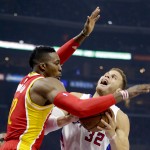 
              Houston Rockets center Dwight Howard, left, blocks Los Angeles Clippers forward Blake Griffin's route to the basket during the first half of Game 3 in a second-round NBA basketball playoff series Friday, May 8, 2015, in Los Angeles. (AP Photo/Jae C. Hong)
            