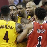 
              The Cleveland Cavaliers and the Chicago Bulls scuffle during the second half of Game 5 in a second-round NBA basketball playoff series Tuesday, May 12, 2015, in Cleveland. (AP Photo/Tony Dejak)
            
